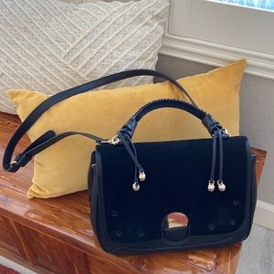 Black leather like and seude clutch and crossbody purse